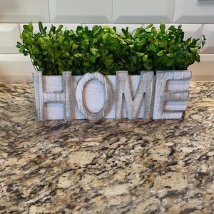 Rustic HOME planter with faux greenery.